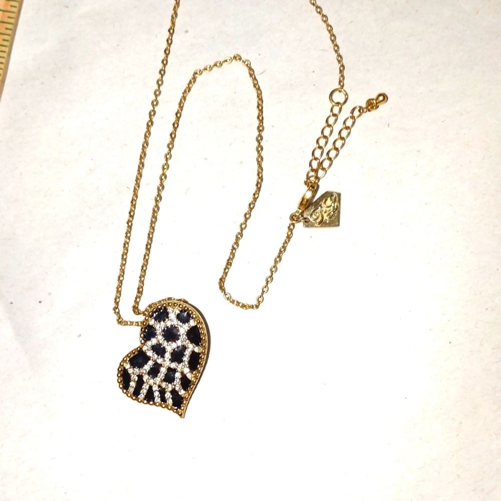 Gold tone offset heart with tagged